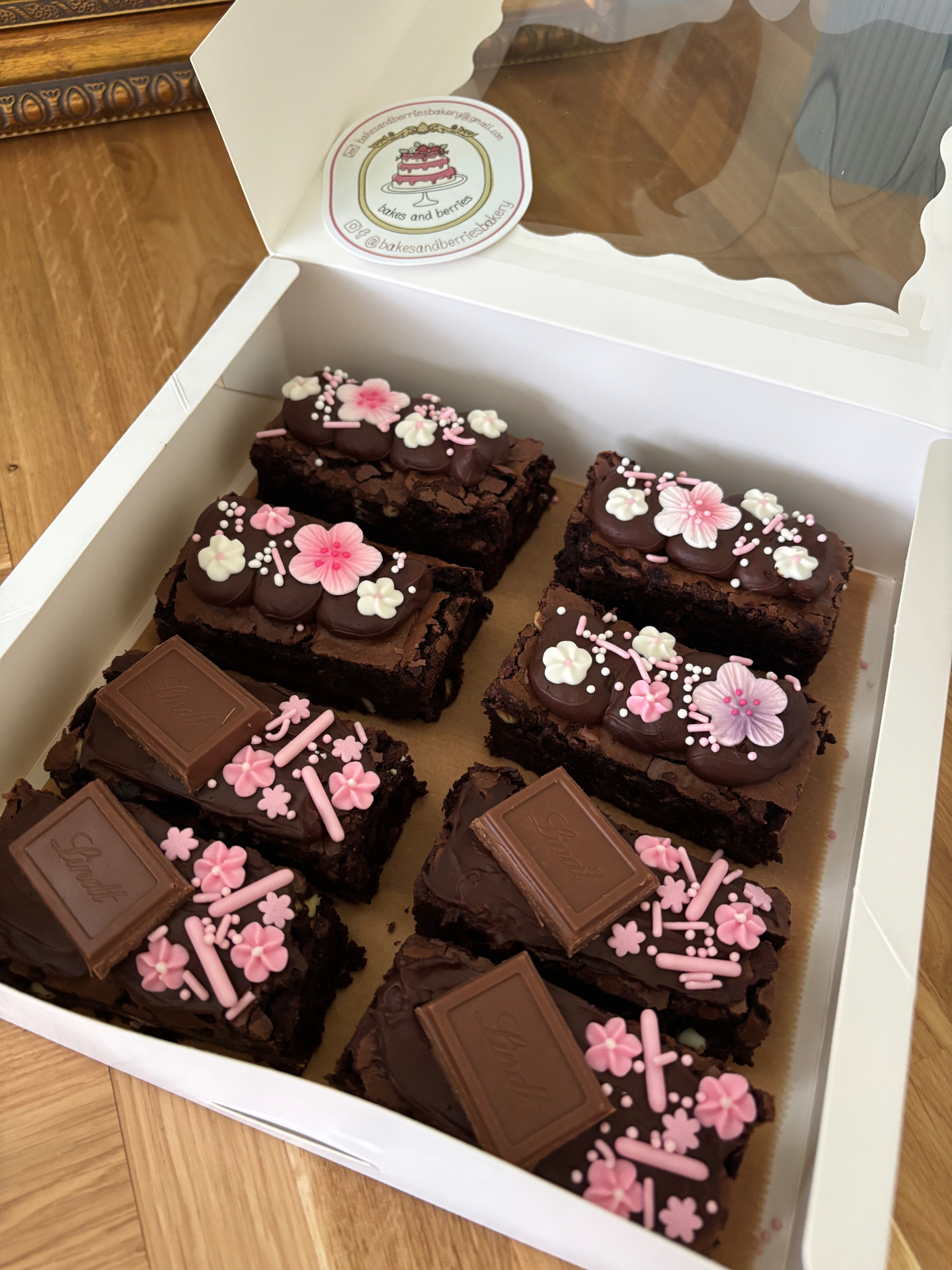 Boxed brownies with pink blossom sprinkles and Lindt chocolate squares