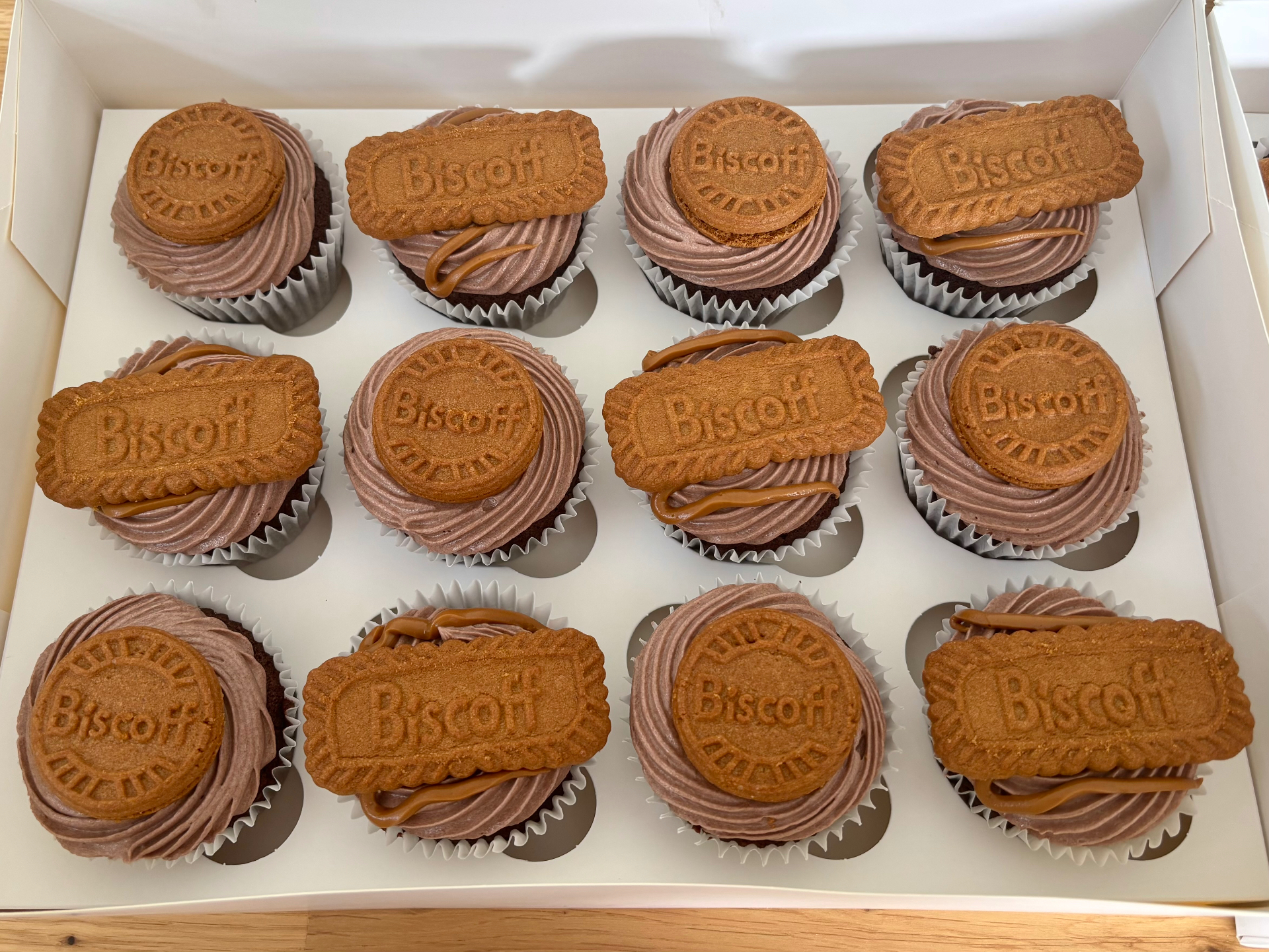 Box of twelve chocolate cupcakes with Biscoff filling, chocolate buttercream and Biscoff biscuits